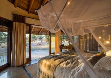 Luxury safari lodge suite in Greater Kruger National Park with private deck overlooking African bush